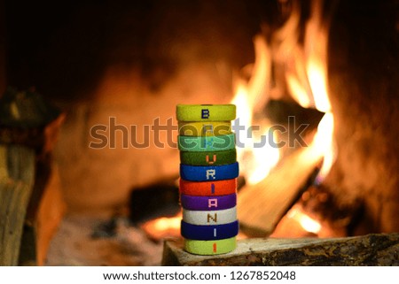 bracelets for hands against the backdrop of fire