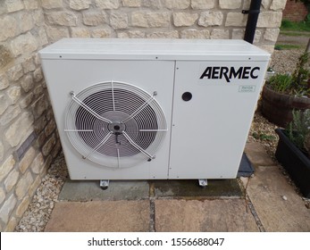 Brackley, Northamptonshire, England - May 15th 2019: Renewable Energy. Domestic Air Source Heat Pump Fitted To English Rural House. ASHP. Reduced Carbon Footprint Through Energy Efficiency.