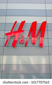 Bracknell, England - February 04, 2018: H & M shop sign on the outside of the fashion store in Bracknell, England. Originally from Sweden, H&M opened their first store in London in 1976