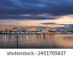 Bradenton, Florida, USA downtown cityscape on the Manatee River at dusk.