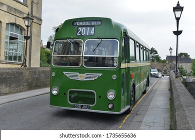 Bradford On Avon, UK - June 19, 2014: An Old School Bus Carries A Wedding Party On A Town Centre Road.