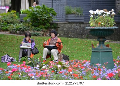 Bradford on Avon, UK - September 27, 2014: Women paint on canvass in a town centre park. The Wiltshire town is growing in popularity as a travel destination.