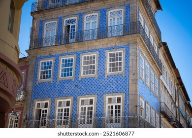 Braga, Portugal - Traditional blue-tiled building in the city center with wrought-iron balconies. - Powered by Shutterstock