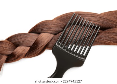 Braided brown hair with brush on white background, closeup - Shutterstock ID 2294945127