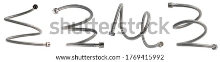 Braided flexible metal hose covered with silicone. Set of hoses twisted in different shapes. Isolated on white background.