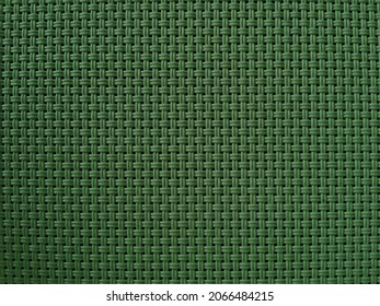 Braided green texture, background weaving of thin rods, weaving a seamless texture. Braided texture for the background.