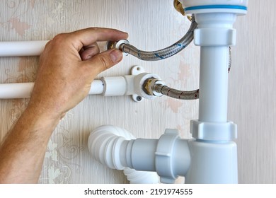 Braided plumbing hoses are used to install faucet in bathroom and connect to home water supply system.