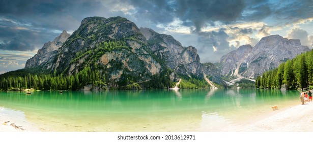 Braies, 11 July 2011: Tourists relax on the shores of the splendid Lake Braies in the Dolomites. South Tyrol, Italy