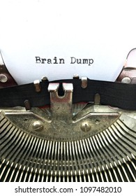 Brain Dump, Two Words Typed In Black Ink On White Paper On Old Retro Vintage Manual Typewriter Machine