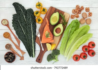 Brain health food nutrition concept with fish, vegetables, seeds, pollen grain and herbs on rustic  background. Foods high in vitamins, minerals, antioxidants, anthocyanins and omega 3.  