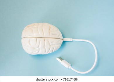 Brain with inserted in socket plug wire or charging cord. Concept technology wired transmission of data, information, knowledge in brain nervous system, mental or psychic connection or charging brain