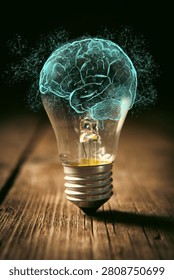 Brain inside a light bulb on a wooden background. Brainstorming concept