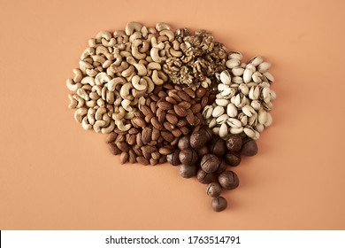 Brain Made Up Of Nuts Isolated On Beige Background, Healthy Snack, Concept Photography For Food Blog Or Advertising