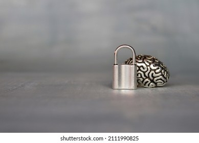 Brain model with a padlock. Copy space for text. Unlocking the brain's full potential concept.