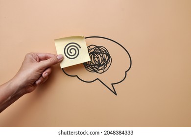 A brain silhouette with a pattern of confusion and a sticker with a pattern of clear lines. Replacing confusion in the head with clear thinking