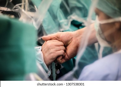 Brain Tumor Surgery. Image Shows Interaction Between Patient And Doctor During Procedure