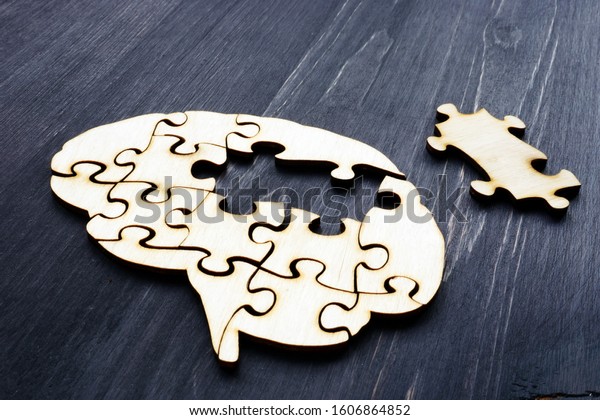 Brain from wooden puzzles. Mental Health and\
problems with memory.
