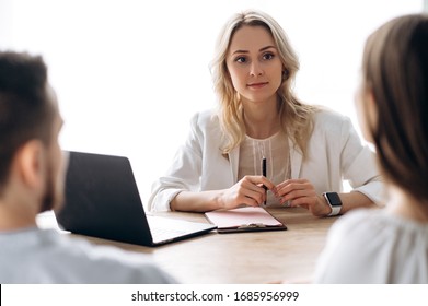 Brainstorm with business colleagues. Girl supervisor holds a meeting with her business team in the office