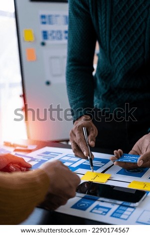 Brainstorm mobile app interface layout design ideas on graphic designer table.ux graphic designer creative sketch planning Mobile web prototype development process vertical image