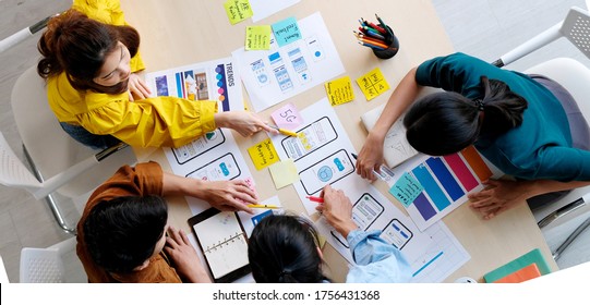Brainstorm planing creative asian teamwork, Group of asia mobile phone app developer team meeting for ideas about screen display prototype smartphone layout, ux startup small business, top view - Shutterstock ID 1756431368
