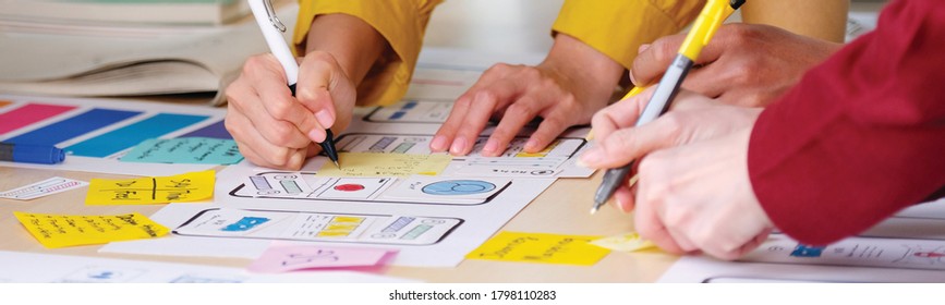 Brainstorm planing creative teamwork,  Close up of hands mobile phone app developer team meeting about screen display prototype layout for smartphone, ui, ux concept - Shutterstock ID 1798110283