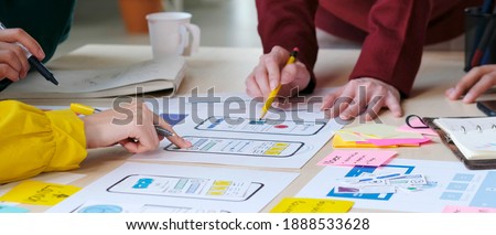 Brainstorm planing creative teamwork,  Close up of hands mobile phone app developer team meeting about screen display prototype layout for smartphone, ui, ux concept