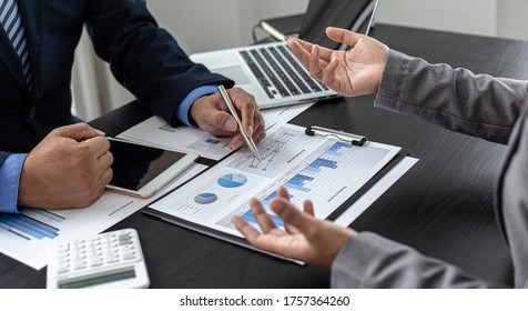 Brainstorm team, Marketers and financial accountants are discussing and analyzing charts to plan strategies to meet customer needs, Computer and tablet technology for business concept. - Shutterstock ID 1757364260