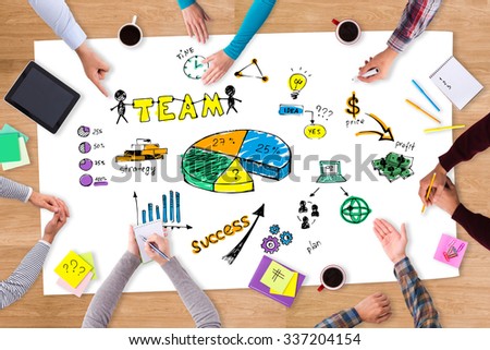 Brainstorm. Top view close-up image of people sitting at the wooden table with colorful sketches on it 