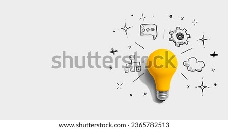 Brainstorming concept with a light bulb - Flat lay