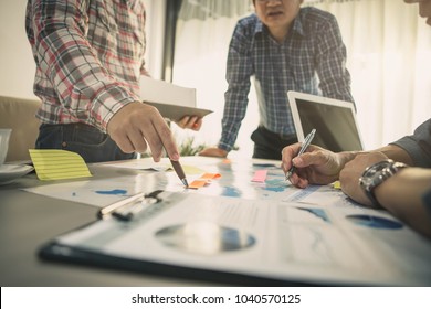 Brainstorming Group Of People Working Concept. Business Team Brainstorming. Marketing Plan Researching. Paperwork On The Table, Laptop And Mobile Phone.