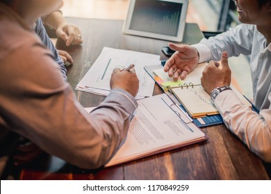 Brainstorming Group of people Working Concept. Business team brainstorming. Marketing plan researching. Paperwork on the table, laptop . - Shutterstock ID 1170849259