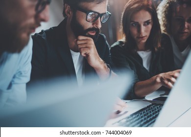 Brainstorming Meetup At Night Office.Young Coworkers Work Together Modern Office Studio.Horizontal.Blurred Background