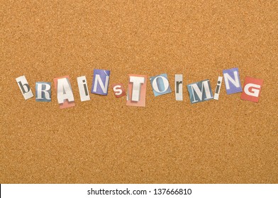 Brainstorming Word Made From Newspaper Letter Shot Over Pinboard Background