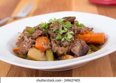 Braised Beef Pot Roast Stew With Vegetables On Table