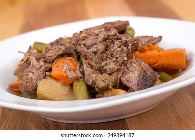 Braised Beef Pot Roast Stew With Vegetables On Table