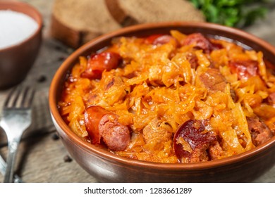 Braised cabbage with meat and smoked sausage. Traditional Polish and Lithuanian dishes.