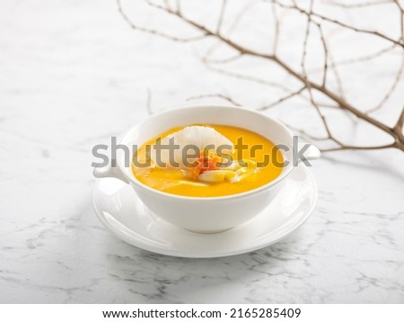 Braised Shark’s Fin Soup with Crab Roe served in a bowl isolated on grey background