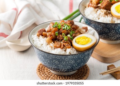 Braised meat rice, close up of stewed pork over cooked rice in Taiwan. Taiwanese famous traditional street food delicacy.