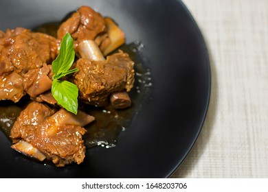 Braised Pork Ribs In A Black Dish