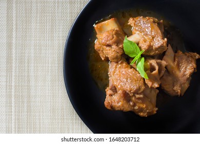 Braised Pork Ribs In A Black Dish