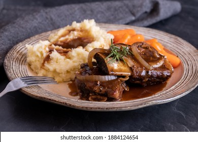 Braised Short Ribs With Mashed Potatoes And Baby Carrots Ready For Eating.