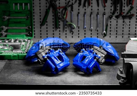 Brake calipers of a car after repair and painting