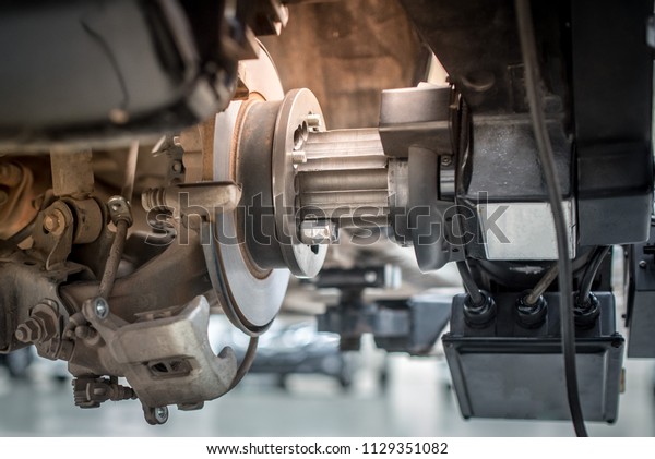 Brake disc\
grinding machine - Vehicle brake-disc turning machine. Automobile\
disc brake system repair in\
garage.