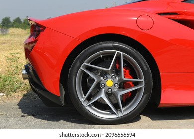 Brake Disc with Red Sport Racing Calliper on wheel of red sport supper car 