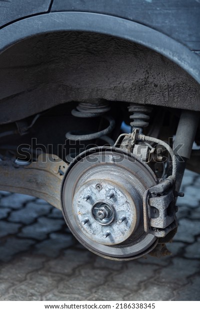 Brake disc and used\
brake pads on old car