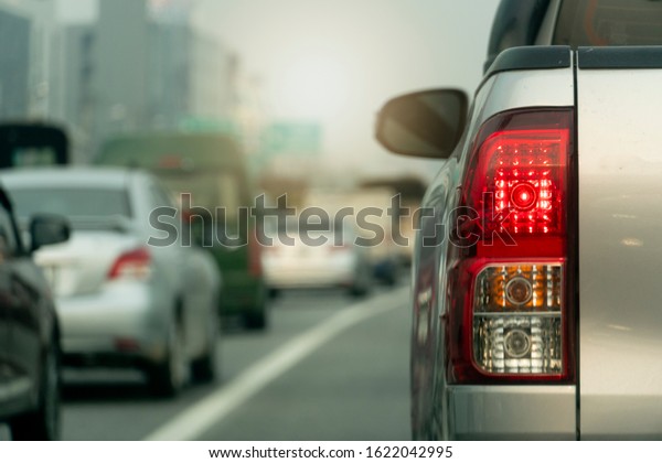 Brake light of pick up car stop on the road.\
 With many cars traffic jam in rush\
hour