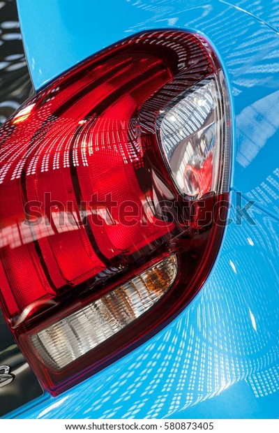 brake lights on the blue vehicles, note shallow\
depth of field