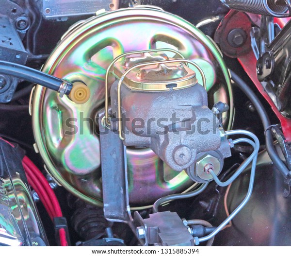 Brake master\
cylinder and booster on a\
car