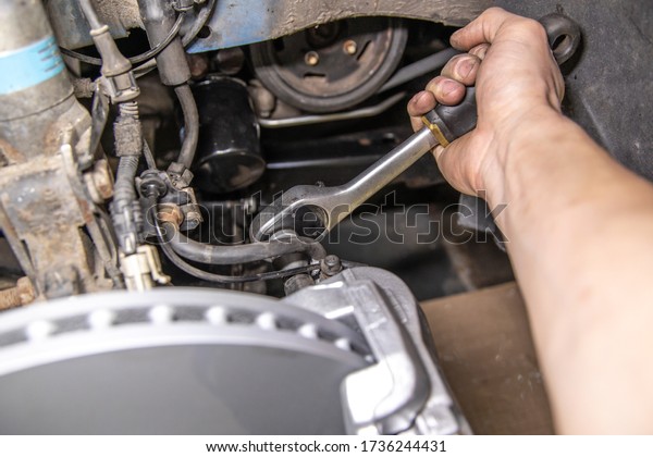 Brake mount in the car repair shop completely brake\
disc wheel box strut