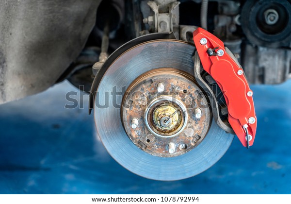 brake pad and disk on\
car